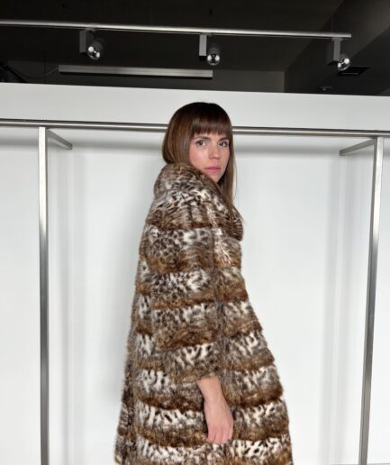 Real sectional mink fur coat in leopard printed in horizontal technique with stand up collar. Real fur in a budget.