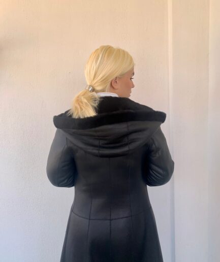 Real lshearling fur coat in black nappa mouton with hood in A-line. Genuine thick shearling jacket. Real sheepskin fur coat, luxury fur gift