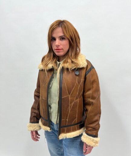 Real sheepskin sectional fur jacket with leather trims .Extremely warm shearling fur modern and affordable luxury fur gift.