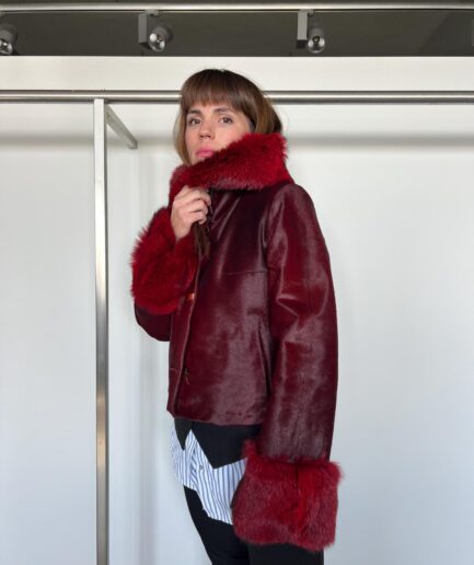 Genuine hair-on cherry leather coat, real hide transitional jacket.Luxurious lightweight calf jacket with buttons and fox fur details.