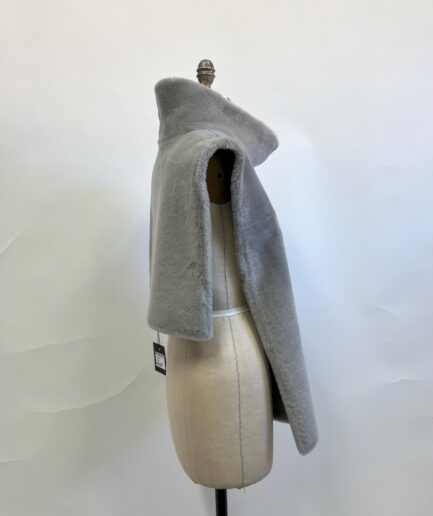 Genuine taupe shawl poncho in real shearling short fur. Paired with beautiful cuffs and lining.