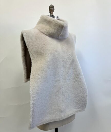 Genuine gray shawl poncho in real shearling short fur. Paired with beautiful cuffs and lining.