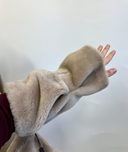 Genuine off white shawl poncho in real shearling short fur. Paired with beautiful cuffs and lining.